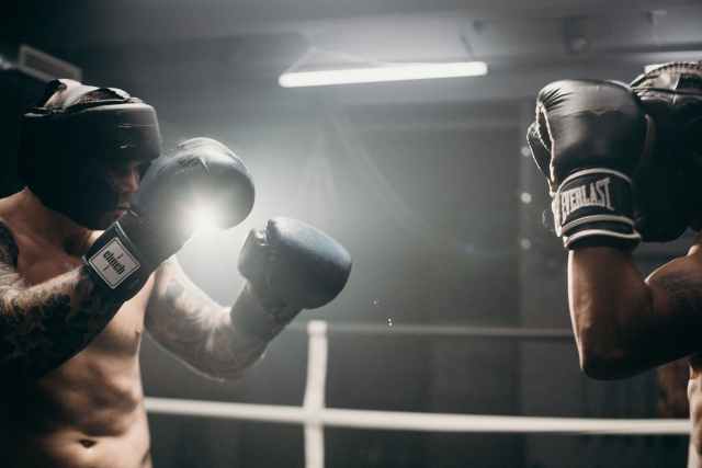 man in black boxing gloves
